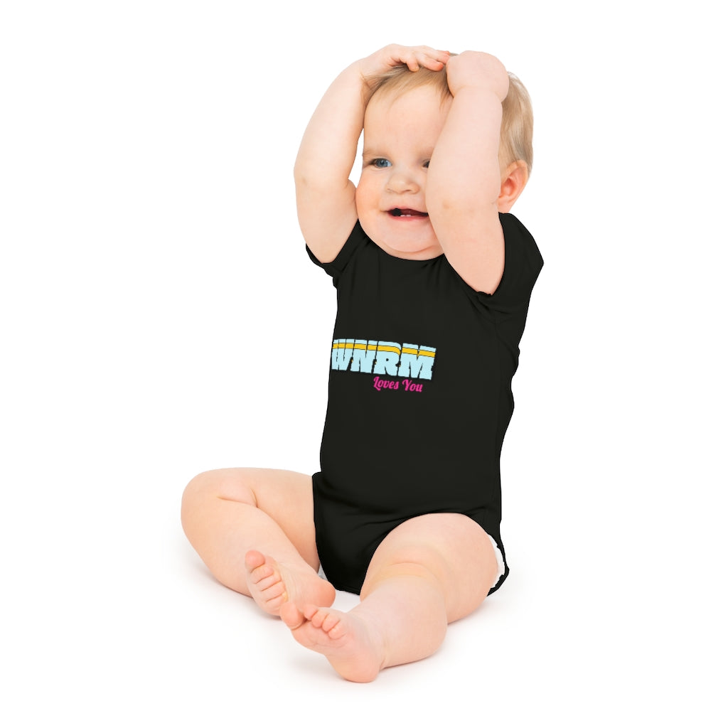 Baby with hands on head wearing a WNRM Loves You Baby Short Sleeve Bodysuit