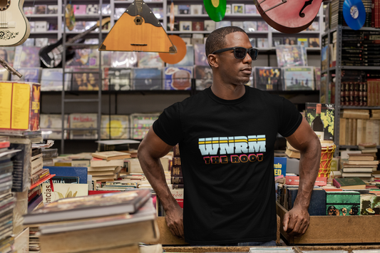 Cool, hot guy wearing a WNRM The Root 3 tone Unisex Heavy Cotton Tee, in a old school record store