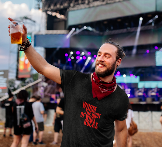 Happy guy at a music festival wearing a OG WNRM Logo Red Men's Lightweight Fashion Tee holding up a beer