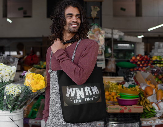 Cool guy carrying a OG WNRM Boobs Bag Organic Canvas Tote Bag at a farmers market,